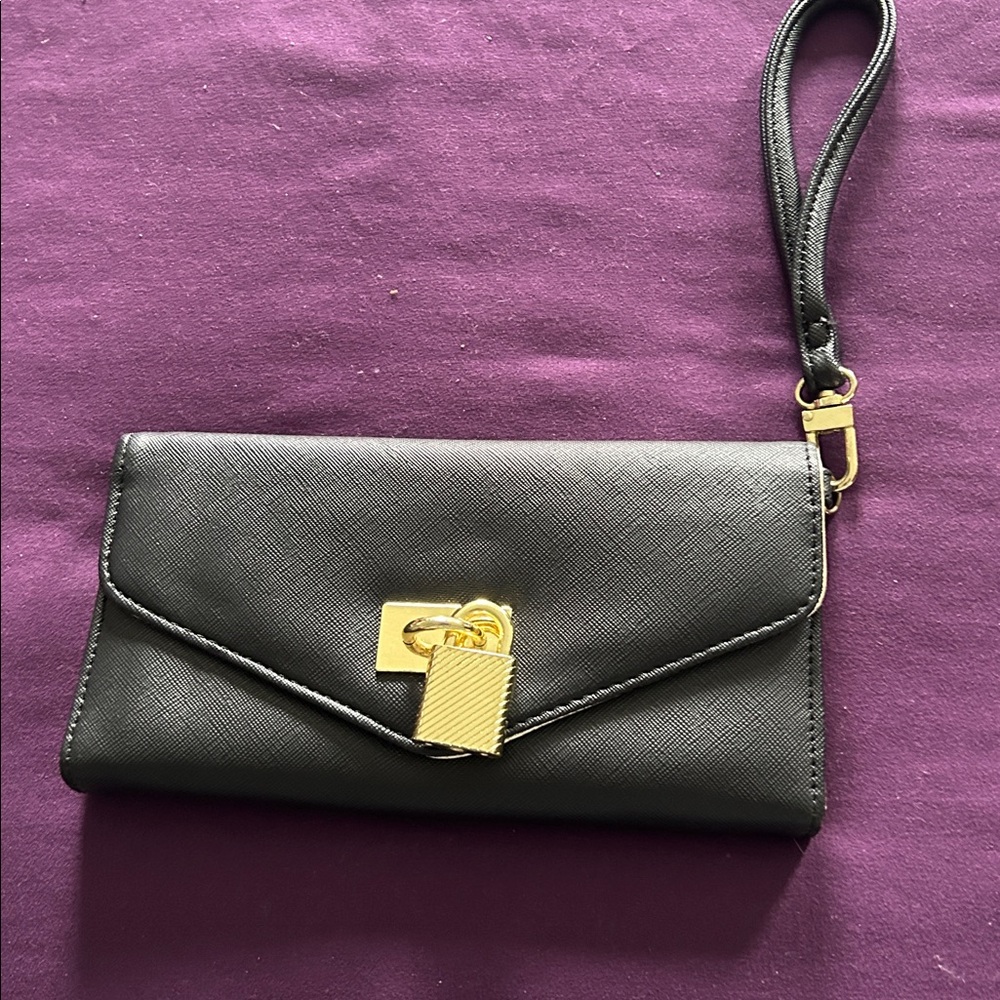 Steve Madden Black Envelope Clutch with Gold Details.  Mint condition.